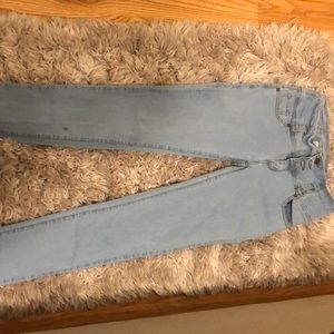 High waisted light wash blue jeans